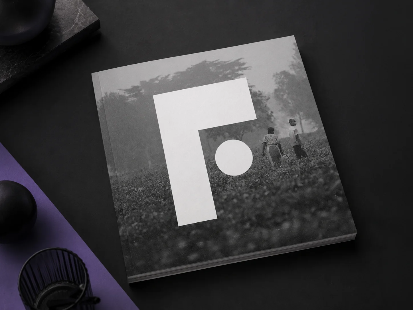 Blood:Water FUEL donor program identity on a black and white printed book
